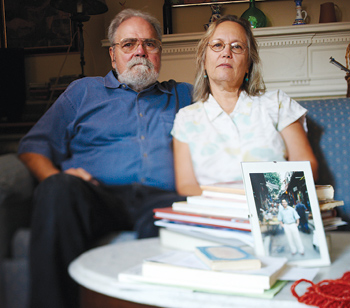 Orlando Rodriguez, Ph.D., and his wife, Phyllis, at home with a photo of their son, Greg. Photo by Ryan Brenizer