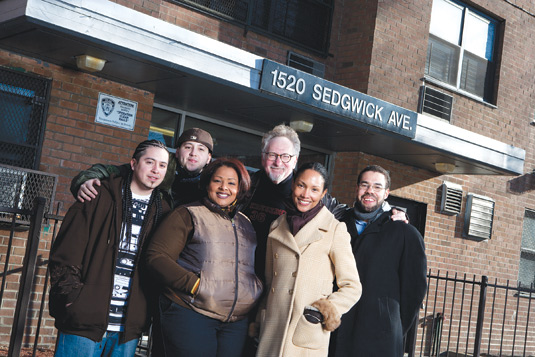 Born in the Bronx: Members of the Bronx African American History Project and the hip-hop group Rebel Diaz gathered at the birthplace of the genre. From left to right: Rodstarz, G1, and Lah Tere, of Rebel Diaz; Fordham professors Mark Naison, Ph.D., Oneka LaBennett, Ph.D., and former Fordham professor Brian Purnell, Ph.D.. Rebel Diaz will be performing at the BAAHP’s anniversary celebration on April 6. Photo by Bud Glick