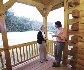 Aloisio extols the virtues of cabin life to Nancy Busch, Ph.D., dean of the Graduate School of Arts and Sciences. Photo by Bruce Gilbert