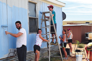 Students participating in last year’s Go! Navajo project painted a house belonging to Navajo elders in Blanding, Utah.  Photo courtesy of Global Outreach