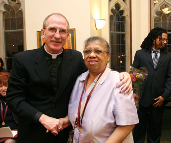 Wilhelmina “Willie” Mitchell, an administrative assistant and researcher for the Office of Development and University Relations, received a medal for her 20 years at Fordham. Photo by Bruce Gilbert