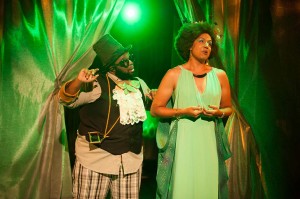 Jones alter ego Jomama Jones (r) as Ozma of Oz and Jarrett King (l) as the Woggle Bug, in “Bright Now Beyond,” at Salvage Vanguard Theaterm in 2014. Photo by Erica Nix.