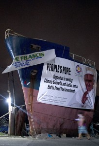 Last January at Barangay Anibong in Tacloban, residents used the side of a grounded ship to welcome the pope's message on climate change. (Noel Celis/AFP/Getty Images)