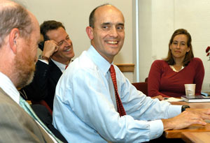 William Treanor (foreground), dean of Fordham Law School, and Martin Flaherty (background), the Leitner Family Professor of International Human Rights, react to a comment made by Judge James E. Baker (center). Photo by Ken Levinson