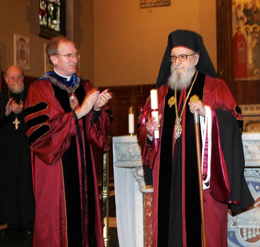  Joseph M. McShane, S.J., president of Fordham, applauds His Eminence Archbishop Demetrios, primate of the Greek Orthodox Church in America, after presenting him with his doctorate of humane letters, honoris causa. Photo by Bruce Gilbert