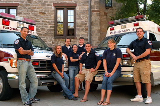 From left, Matt Esposito, Sara Itzkovics, Matthew Niehaus, Ashley Lauria, Tom Reen, T.J. Farrell, Janine Luckie, and Matt Cooney are not only Fordham students, they also run the University's Emergency Medical Services.  Photo by Ken Levinson