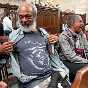 Michael Mitchell displays a t-shirt his wife Ina gave him that holds a special Fordham connection.  (Photo by Bruce Gilbert)