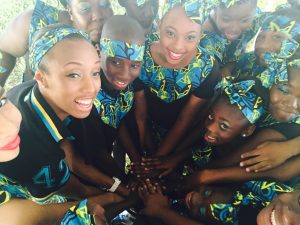 Spears with her young student-dancers as they prepare to perform at a Bahamian independence day celebration. Photo courtesy of Courtney Spears 