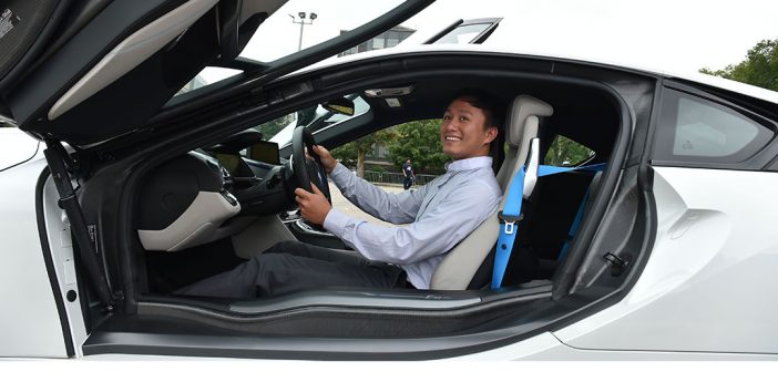 A student in the BMW workshop test drives a new car