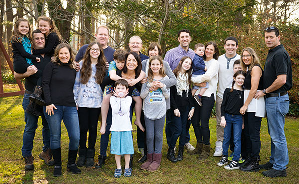 Michael and Judy Bornstein surrounded by their four children, their children’s spouses, and their 11 grandkids. (Photo courtesy of Russell Starr)