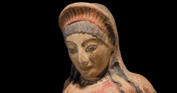 A terracotta antefix depicting an Etruscan woman, one of 260-plus antiquities in the Fordham Museum of Greek, Etruscan, and Roman Art
