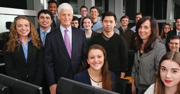 1965 Fordham graduate Mario Gabelli with students in February 2015