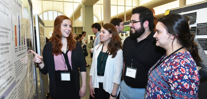 Psychology student Laura Frank, and biology students Olivia Giannakopoulos and Ian Villagran share findings from their research project, "The Effect of Drey Presence on Flight Initiation Distance in the Eastern Gray Squirrel (Sciurus carolinensis) in New York City" at the 2017 Undergraduate Research Symposium on April 26 at the Rose Hill campus.