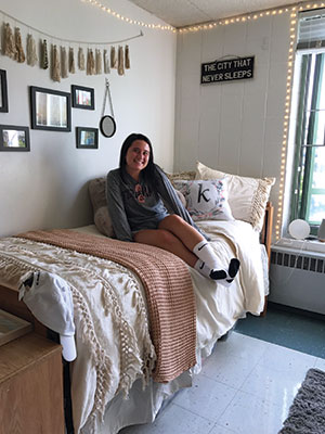 Kate Carney shows off her new dorm decorations.