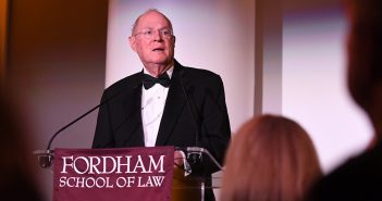 Supreme Court Justice Anthony Kennedy speaks from a podium at Fordham's School of Law