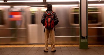 Commuting Student standing on subway platform