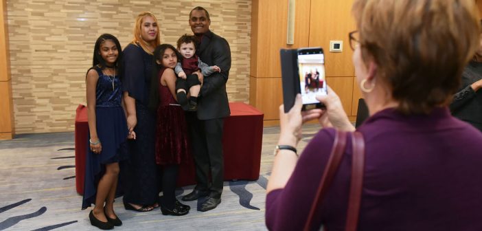 Awardee Jose M. Soto poses for a photo with his family at the 1841 Awards.