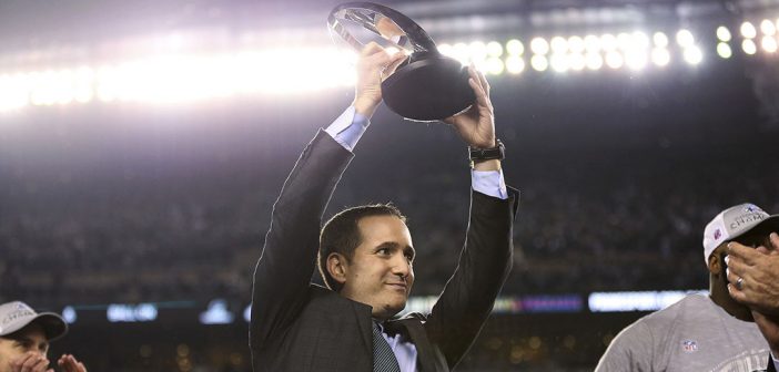 Howie Roseman, Philadelphia Eagles executive vice president of football operations, lifts the NFC championship trophy after the Eagles' 38-7 win over the Minnesota Vikings during the NFC championship NFL football game Sunday, Jan. 21, 2018, in Philadelphia. (David Maialetti/The Philadelphia Inquirer via AP)