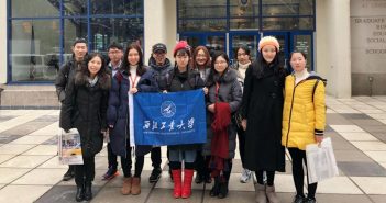 NPU Students from China in front of Fordham Logo