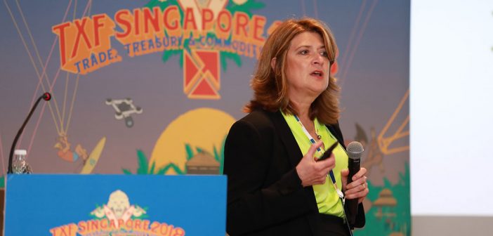 T. Dessa Glasser speaks at a conference in Singapore