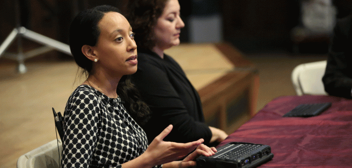 Haben Girma, a deafblind woman who is an advocate for people with disabilities, uses special keyboard at lecture on Rose Hill campus