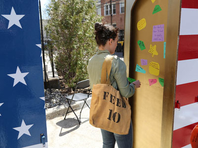 Attendees of Bronx Celebration Day share their cultural roots as part of South Korean artist Sohhee Oh's mobile communal art project, “The Golden Door.” 