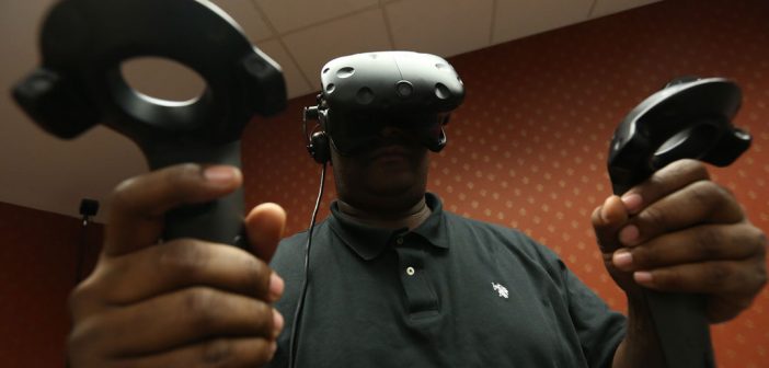 The 2018 cohort of the Executive MBA (EMBA) program at the Gabelli School of Business in Westchester participate in VR/AR exercises focused on teamwork and communication. Photo by Bruce Gilbert