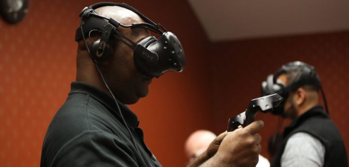 The 2018 cohort of the Executive MBA (EMBA) program at the Gabelli School of Business in Westchester participate in VR/AR exercises focused on teamwork and communication. Photo by Bruce Gilbert