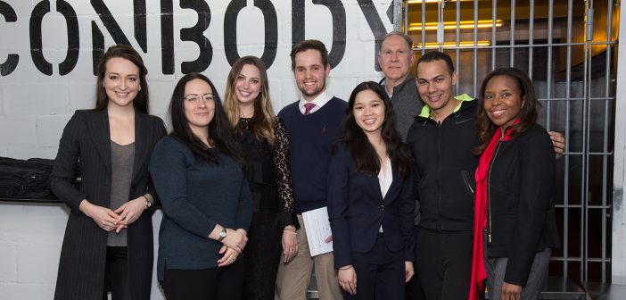 Students in Bernice Grant's Entrepreneurial Law Clinic stand together in Con Body, a boutique gym on the Lower East Side of Manhattan