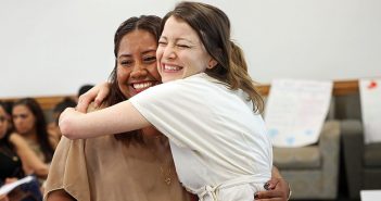 ESl student gets a big hug from her teacher