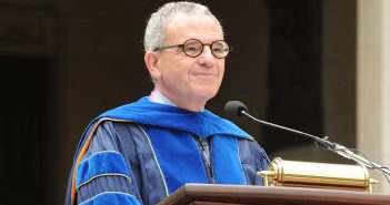 Stephen Freedman, University Provost, as the podium at commencemnt in blue robes