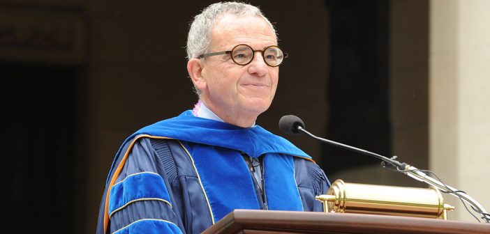 Stephen Freedman, University Provost, as the podium at commencemnt in blue robes