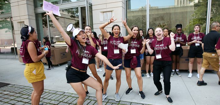 Student volunteers celebrate the arrival of first year students on 62nd street at the Lincoln Center campus.