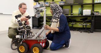 Damian Lyons, Director of Fordham's Robotics and Computer Vision Laboratory, works with his graduate research assistant, Saba Zahra.