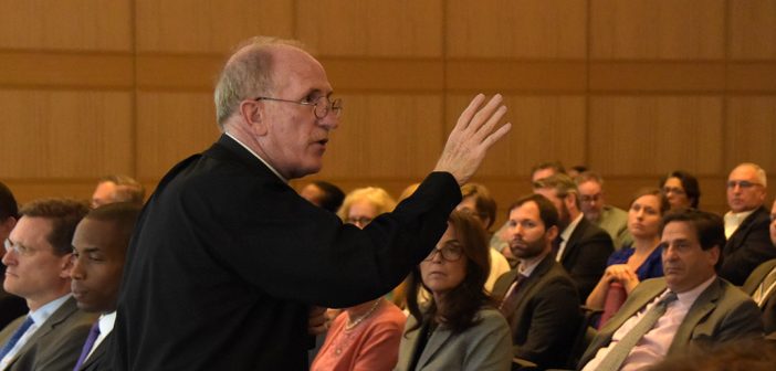 Father McShane addresses a crowd at Fordham Law