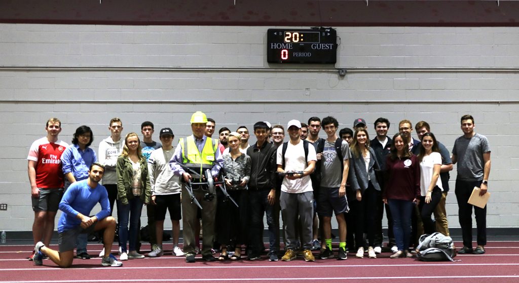 Students in the Introduction to Real Estate Finance class pose for a picture inside the Lombardi Fieldhouse 
