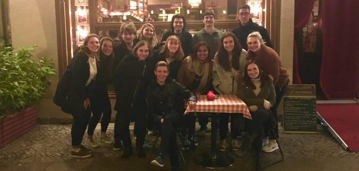 The Berlin students pose for a group picture with their professor in front of a restaurant in Germany.