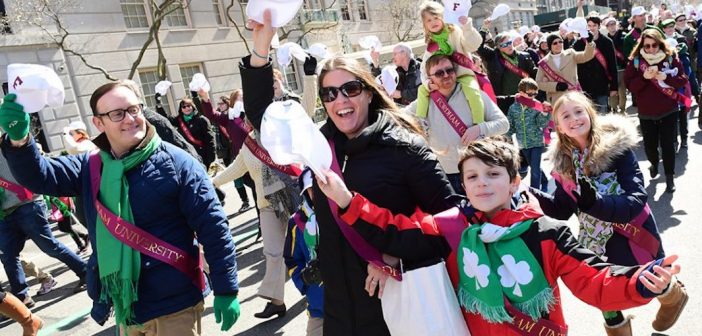 Alums and kids marching in St. Patrick's Day Parade in 2018
