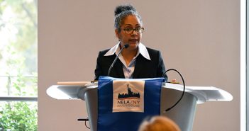 Tanya Hernandez speaking at a podium at Fordham Law