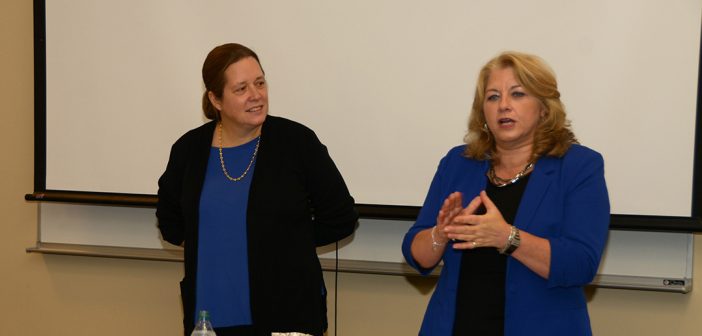 Anne Fernald and Debra McFee address a crowd in the South Lounge in the Lincoln Center campus