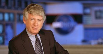 Ted Koppel in suit and tie on set of ABC news