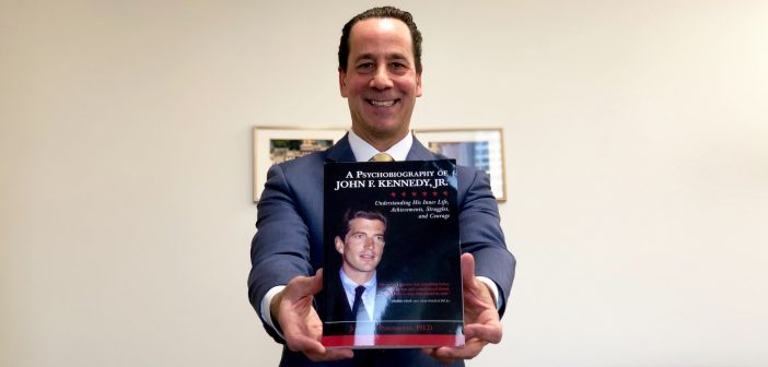 Ponterotto holds a copy of his new book.