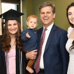 Tim Shriver with his daughters, wife, and grandson