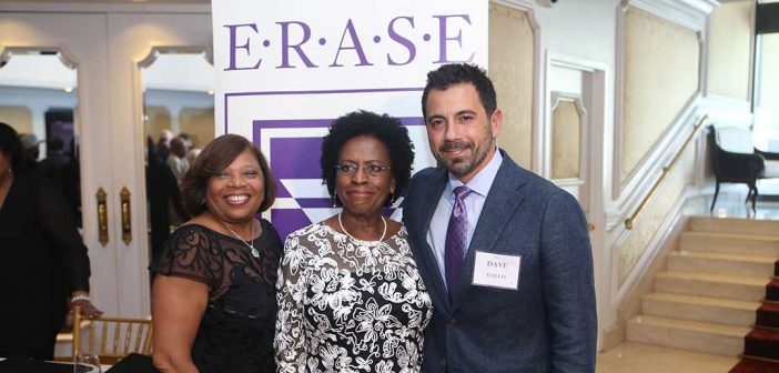 Gross and Lewis receive awards from ERASE Racism's president.