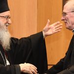 Joseph M. McShane and Archbishop Demetrios exchange hugs