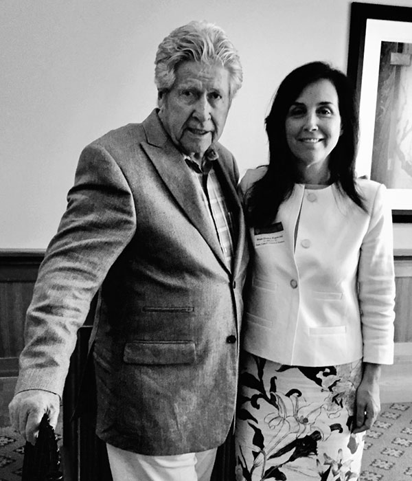 Sequoia Capital founder Don Valentine poses with Donna Rapaccioli, dean of Fordham University's Gabelli School of Business, at Sharon Heights Golf & Country Club in Menlo Park, California, June 1, 2016