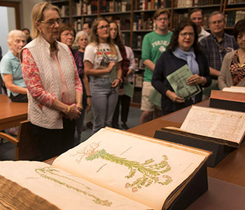 Students and alumni visit the Rare Books Room at the New York Botanical Garden