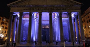 The Pantheon lit in purple light at night