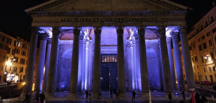 The Pantheon lit in purple light at night