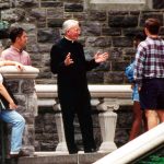 Father O'Hare talking with students at Rose Hill